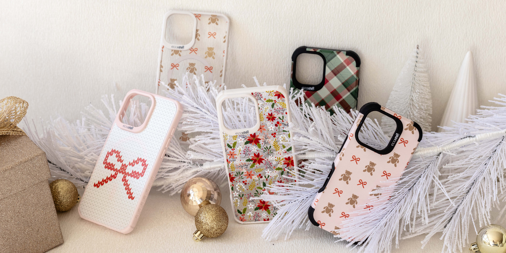 EcoBlvd’s eco-friendly phone cases with holiday designs like poinsettias, plaid, bows, and teddy bears on frosted branches.