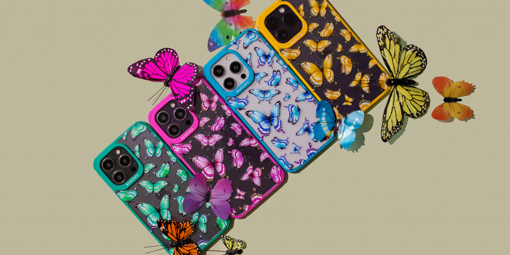 Colorful eco-friendly phone cases featuring the Social Butterfly design from EcoBlvd's Wild Collection, surrounded by butterflies