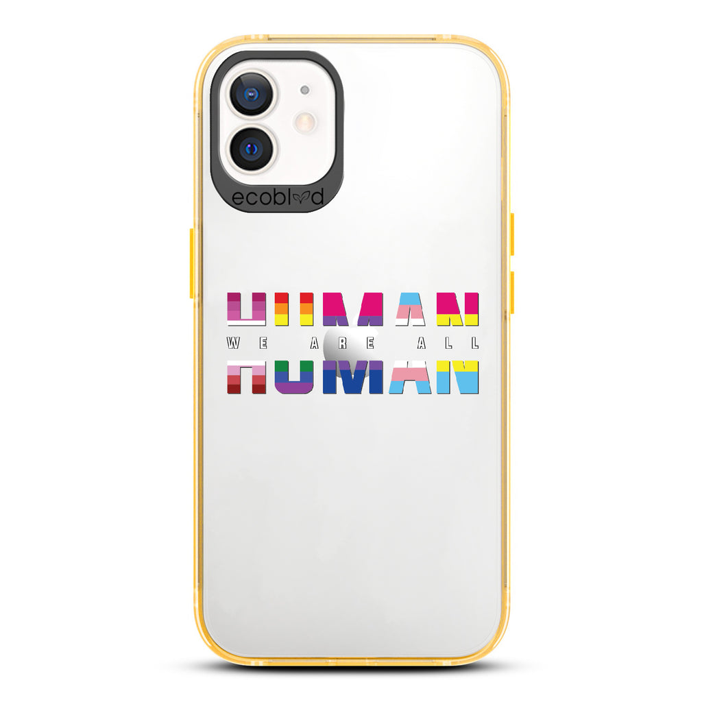 We Are All Human - Yellow Eco-Friendly iPhone 12/12 Pro Case With ?€?We Are All??????+ Human Spelled Out In LGBGTQ+ Flags On A Clear Back